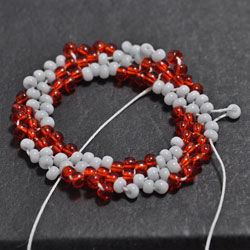 Step 5: Add one bead in between the beads strung in Round 4